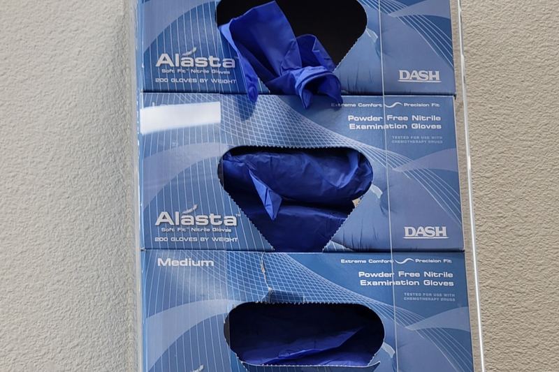 Box of nitrile gloves on a wall holder